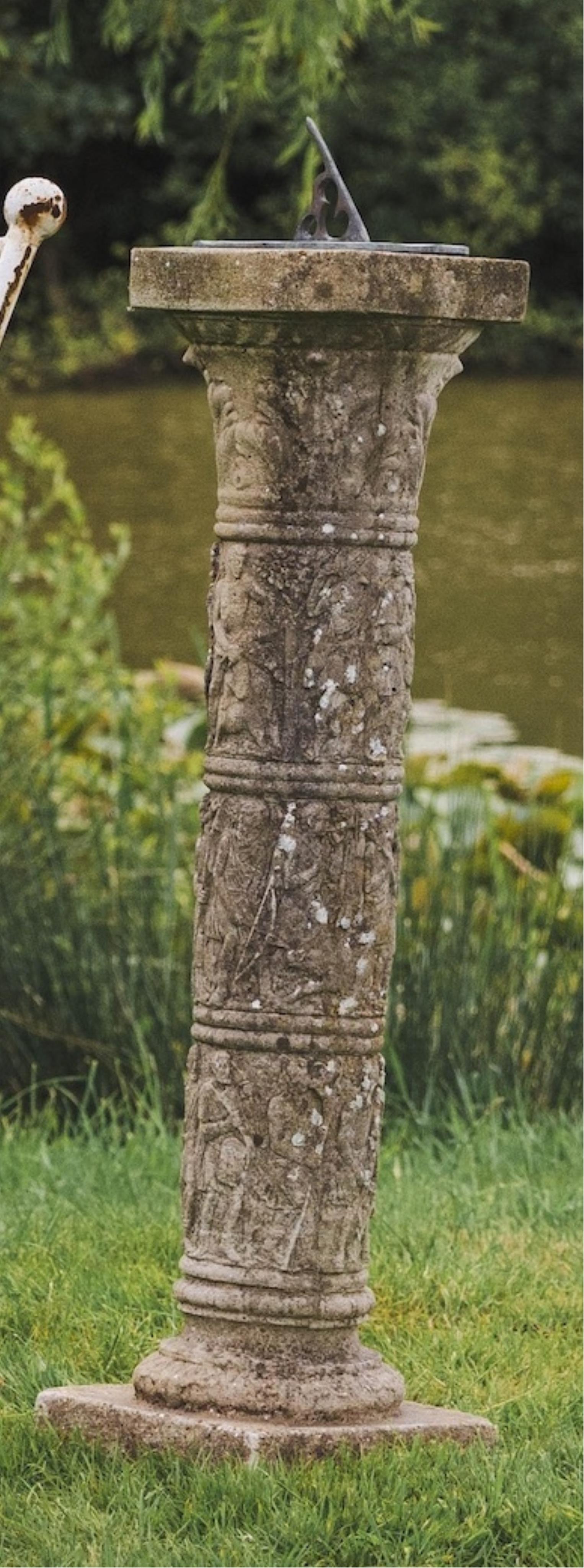 A reconstituted stone and cast metal sundial, height 92cm